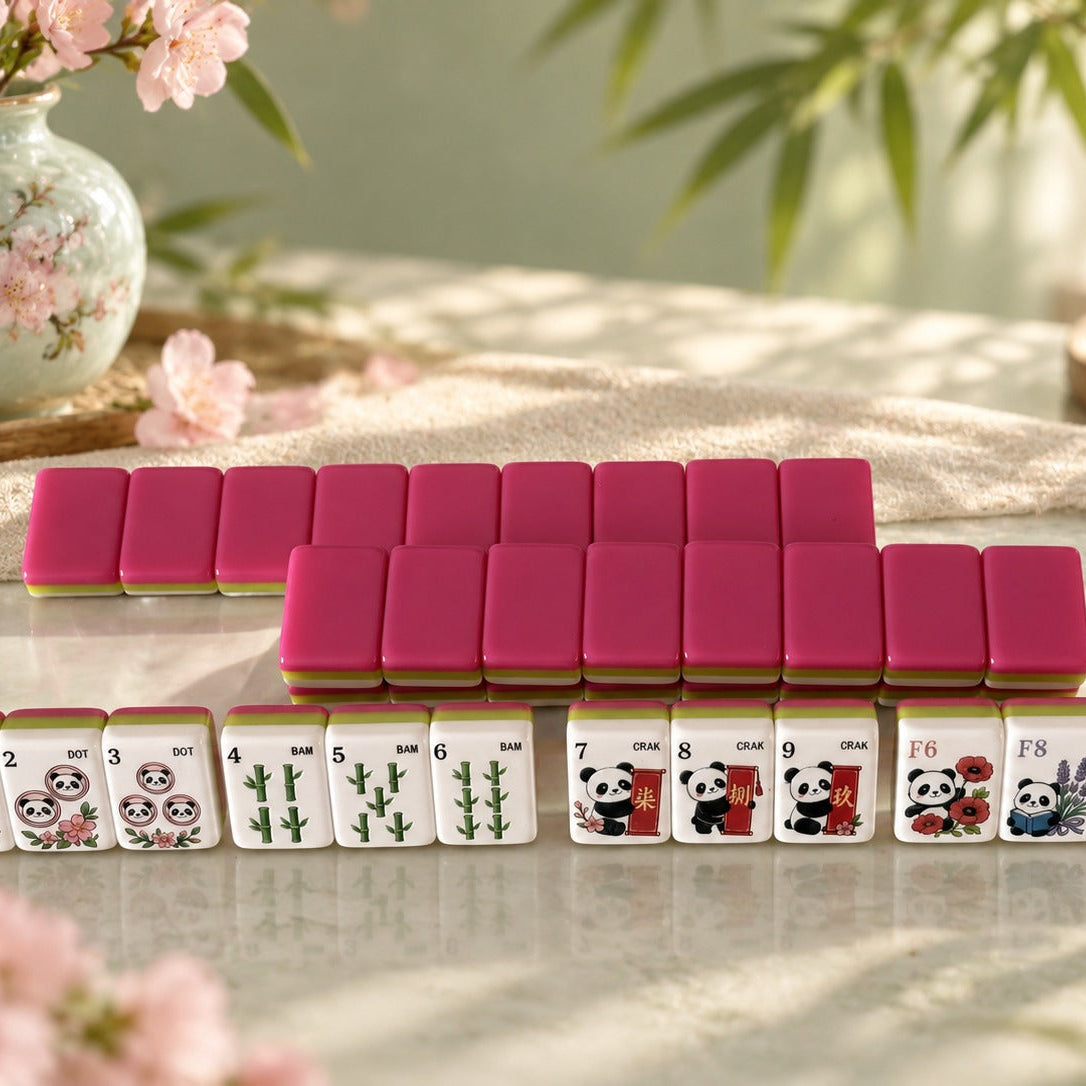 Flat lay top-down view of full Panda Blossom mahjong set fully laid out, all custom panda and floral tile artwork visible, arranged neatly on light green fabric mat