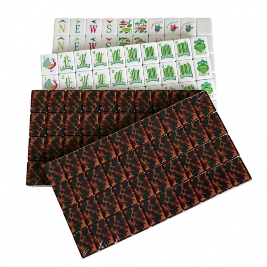 Amber Tortoise Heritage American Mahjong Set by USA Mahjong Co. featuring 166 weighted tiles with classic shell backs and modern compass design.