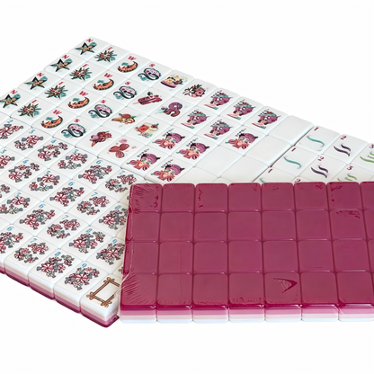 Detailed view of The Berry Sorbet American Mahjong Set by USA Mahjong Co., featuring vibrant pink-red tiles with gold inlays.
