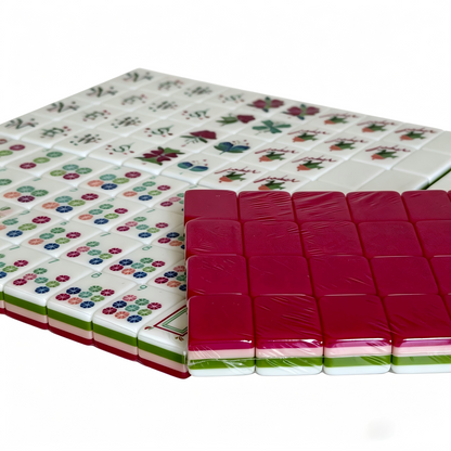 Close-up of Electric Rose American Mahjong set tiles with vibrant hot pink acrylic backs and bold gold inlays by USA Mahjong Co.