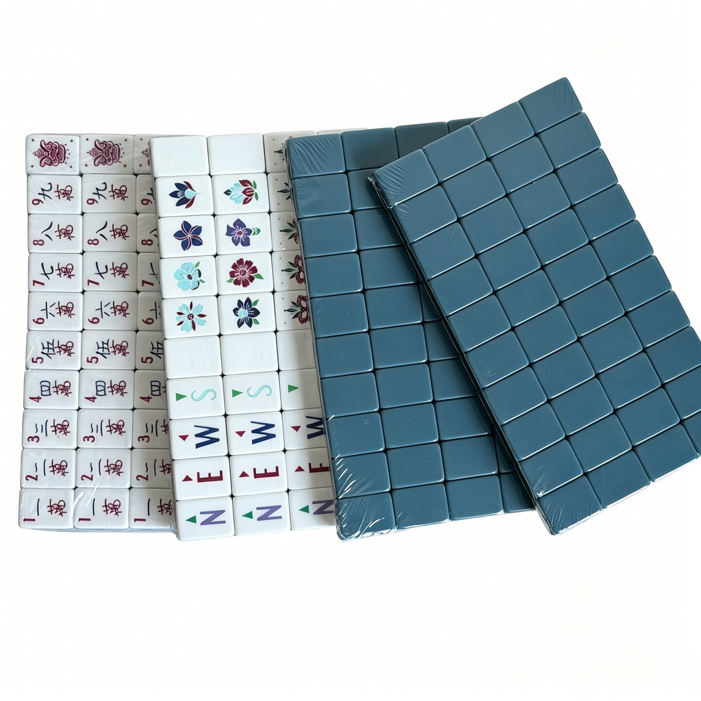 Close-up of Slate Compass American Mahjong Set by USA Mahjong Co. featuring 166 blue-grey acrylic tiles with gold inlays.