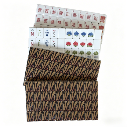 Detailed view of Tiger Strike Heritage American Mahjong Set by USA Mahjong Co. with 166 weighted tiles featuring bold tiger print backs.