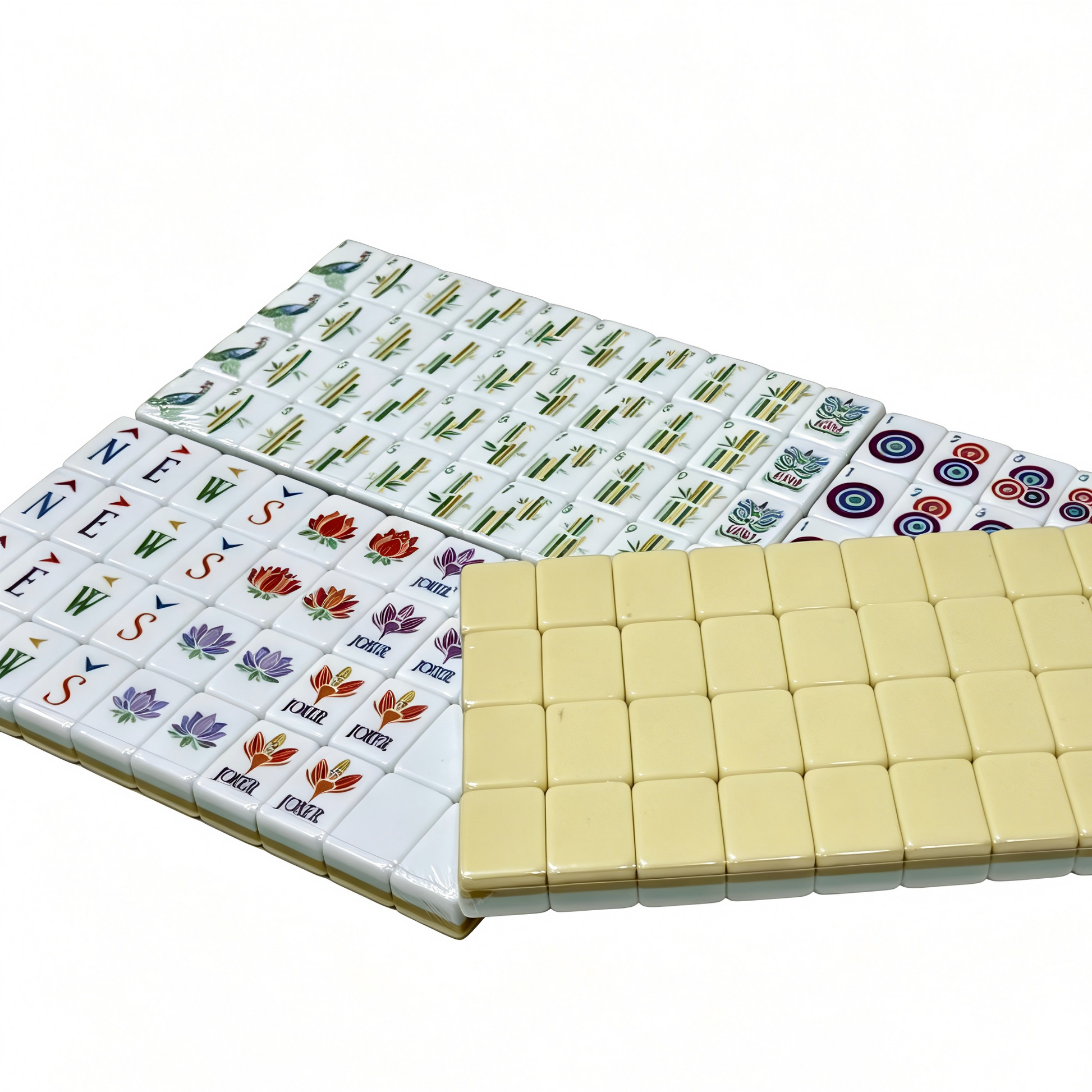 Detailed view of Vanilla Bean Modern American Mahjong Set by USA Mahjong Co. with creamy ivory tiles featuring gold and black inlays.