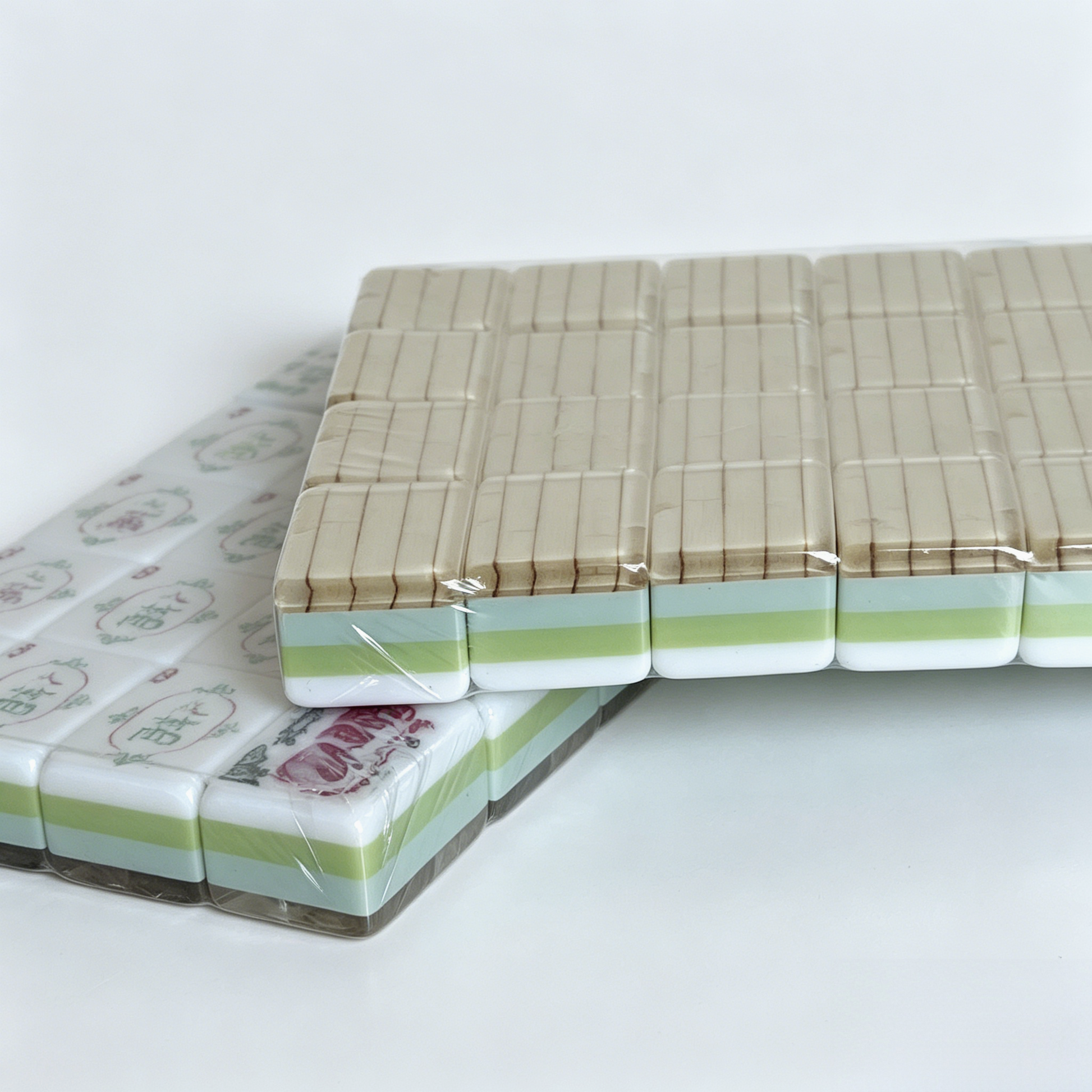 Detailed view of Zen Bamboo American Mahjong Set by USA Mahjong Co., featuring 166 weighted tiles with textured ivory backs and gold inlays.