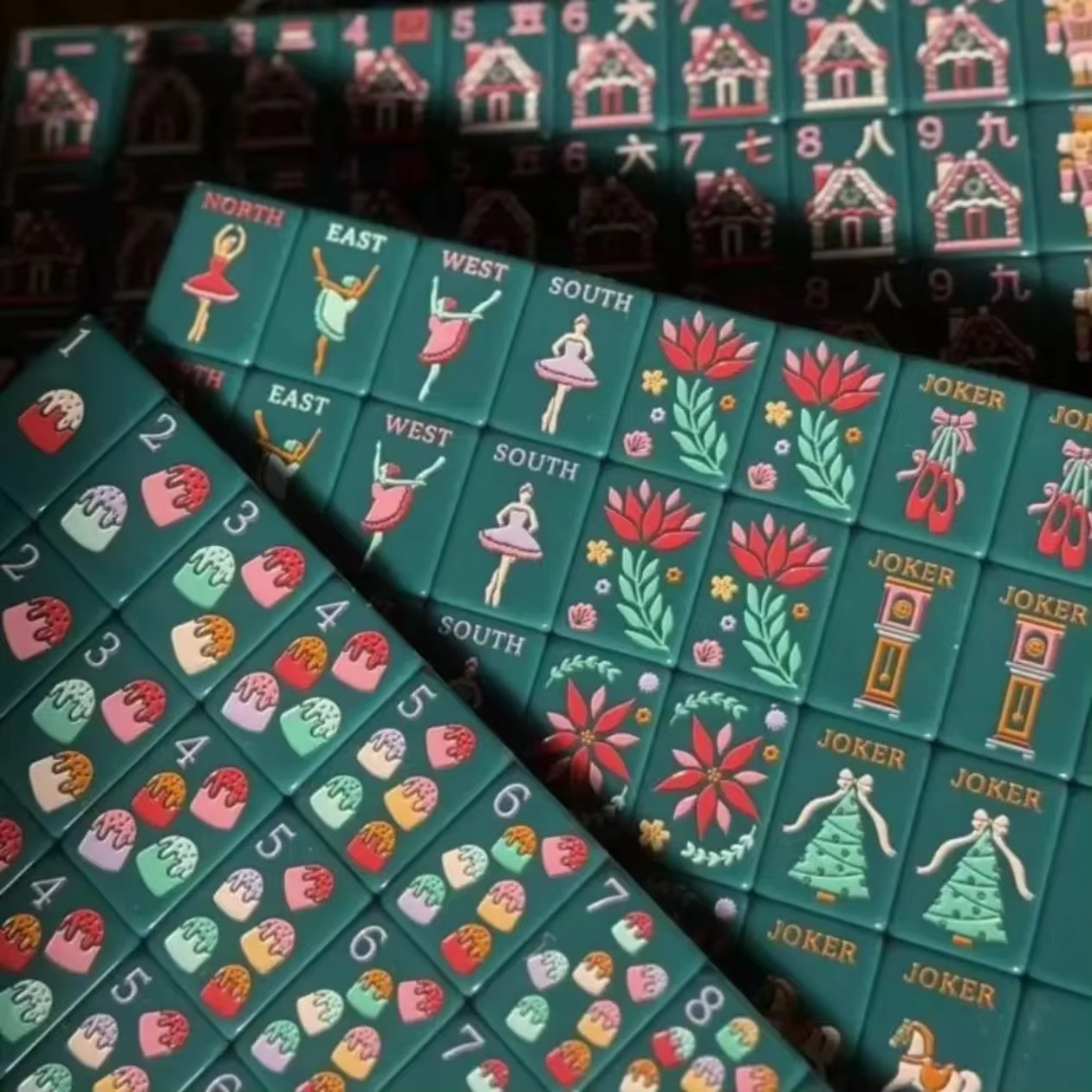 Christmas Mahjong Jokers Close-up - Pink Nutcracker Soldier and Ballet Slipper Joker Tiles on Green Melamine