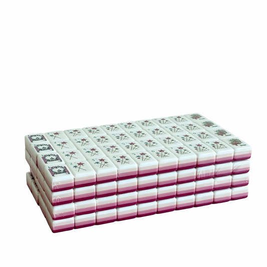 Side profile of USA Mahjong Co.'s Berry Sorbet American Mahjong Set with 32g weighted tiles, deep magenta backs, and candy design.