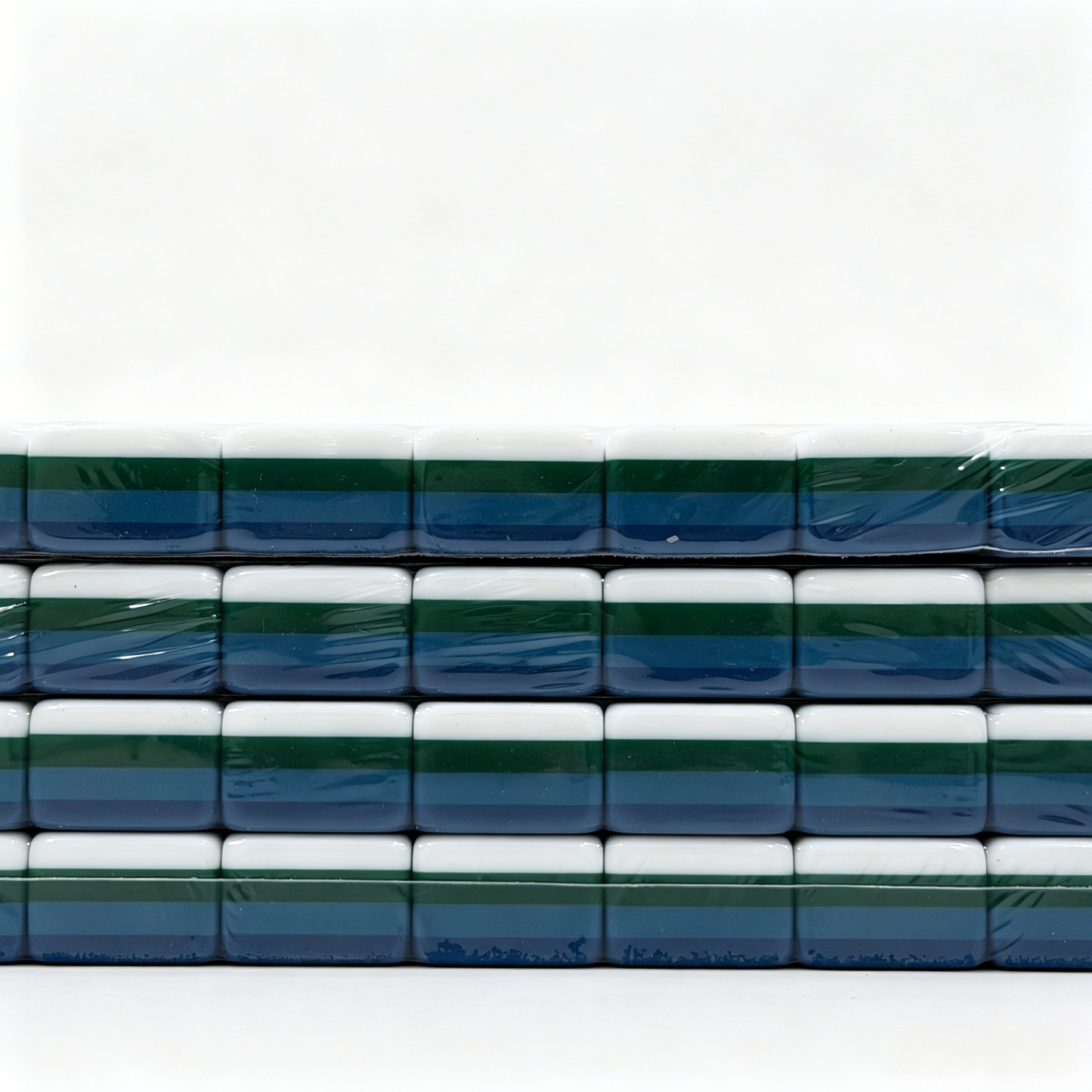Side profile of 32g weighted teal Mahjong tiles with deep petrol backs from the USA Mahjong Co. American Mahjong Set.