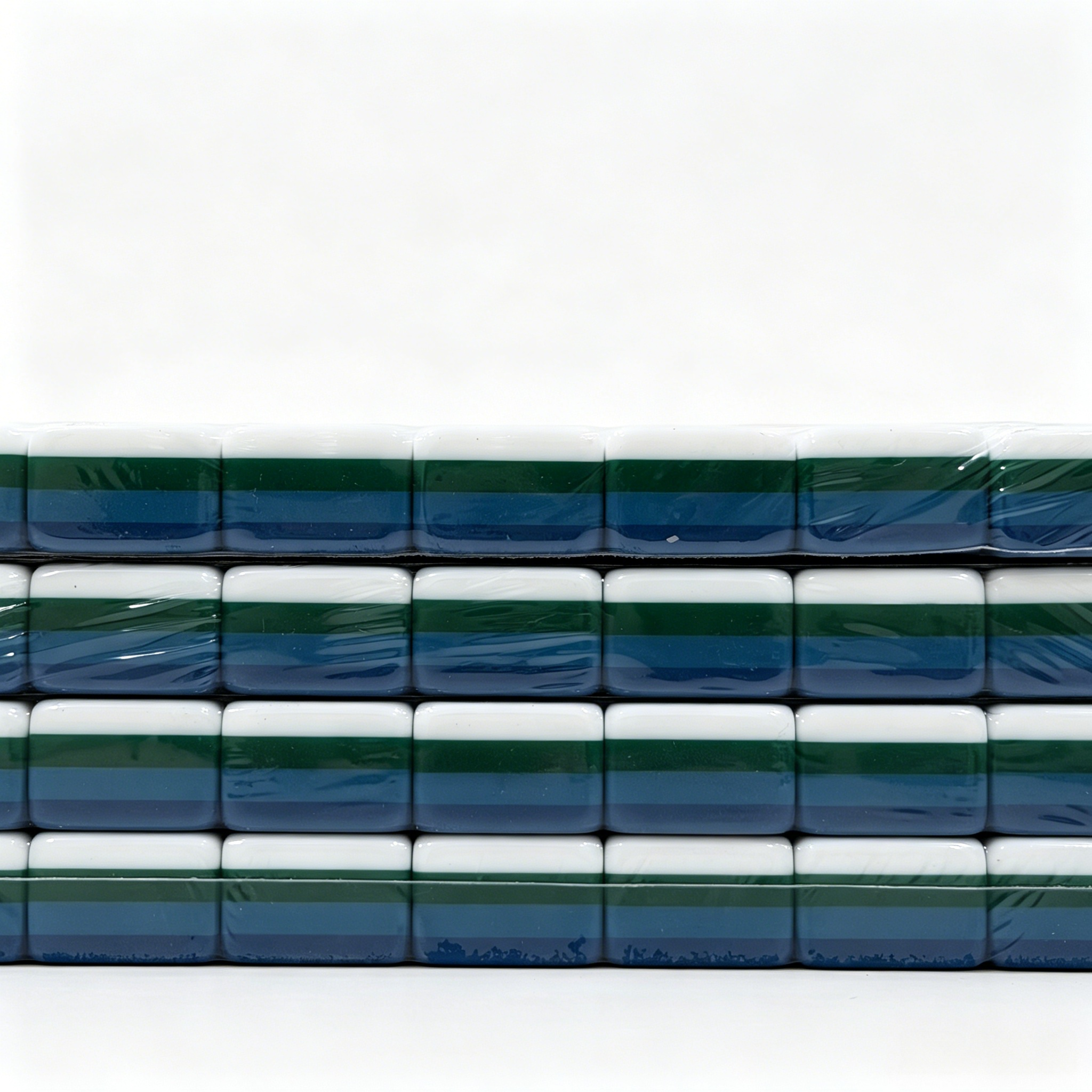 Side profile of 32g weighted teal Mahjong tiles with deep petrol backs from the USA Mahjong Co. American Mahjong Set.