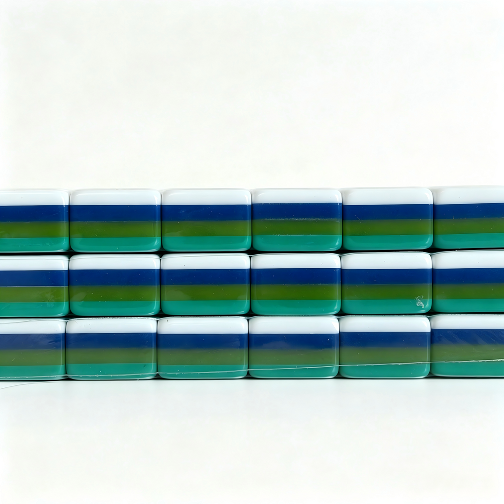 Side profile of teal Lagoon American Mahjong set with 32g weighted tiles, solid teal backs, and monkey jokers by USA Mahjong Co.