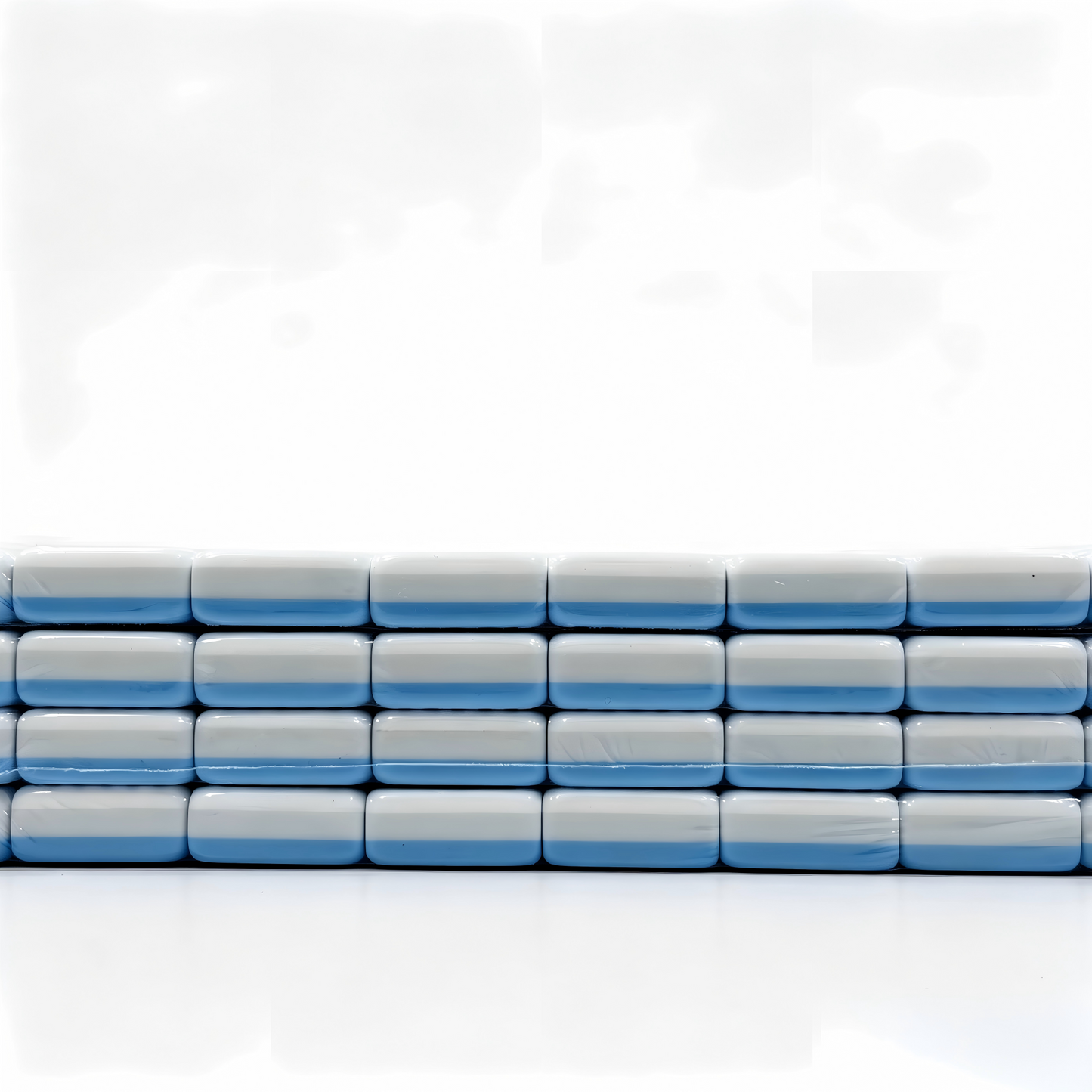 Side view of 32g blue-striped tiles from The Sky Linen American Mahjong Set by USA Mahjong Co., featuring weighted, professional-quality tiles.