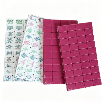 American Mahjong Set by USA Mahjong Co. with 166 weighted acrylic tiles featuring magenta, elephant design, and elegant grey-blue backs.