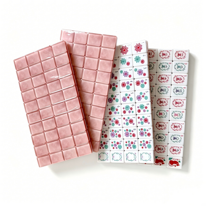 Rose Quartz American Mahjong Set by USA Mahjong Co. with 166 weighted tiles featuring marbled pink backs and intricate designs.