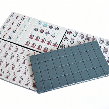 Modern American Mahjong Set by USA Mahjong Co. featuring 166 weighted acrylic tiles with deep petrol backs and intricate tile designs.