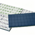 Teal Tea Party American Mahjong Set by USA Mahjong Co. with 166 weighted tiles featuring deep petrol backs, arranged on a table.